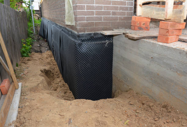 SJ Waterproofing Pros technician performing targeted Interior Drainage System assessment in Johnstown, PA